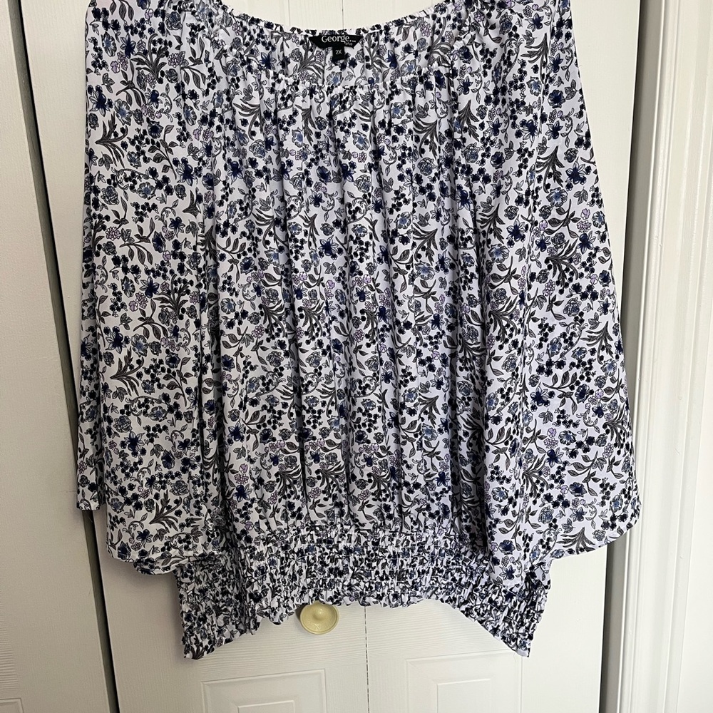 # 122 George Blue and White Smocked High-low Blouse